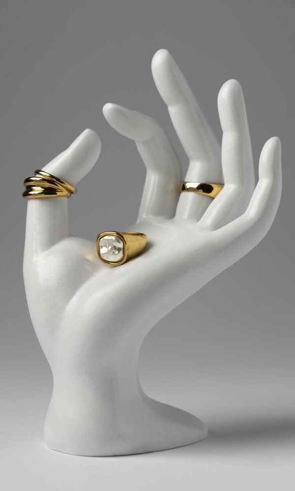 expensive-golden-ring-with-human-hand-stand-display
